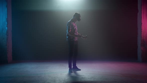 Man In VR Headset Holding Controller