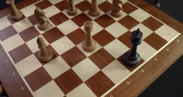 Chess Game Finish on Chessboard with White King Piece Defeating Black King