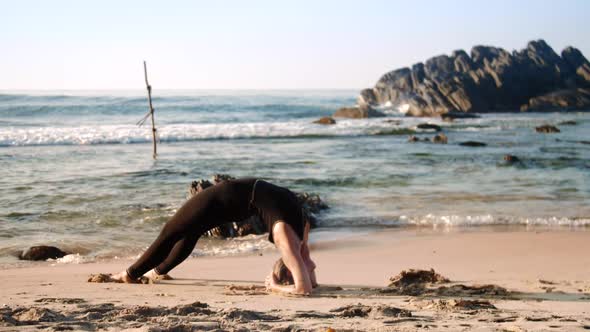 Slim Girl Does Yoga Pose Upward Facing Two-foot Staff