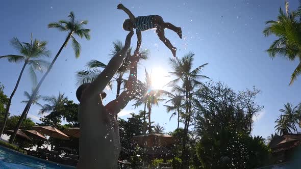 A Loving Single Dad Playfully Throws His Daughter Up in the Air
