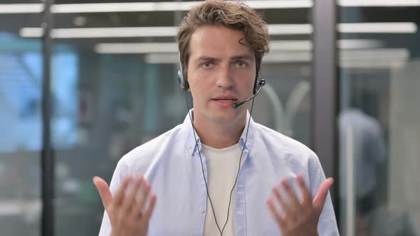 Portrait of Man Talking on Headset