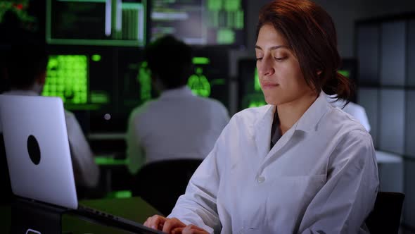 Medical Research Scientist Typing on His Desktop Computer in a Biological Applied Science Research