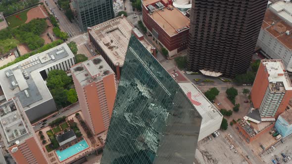 High Angle View of Sharp Ridge on Top of Tall Glass Covered Unusual Shape Building