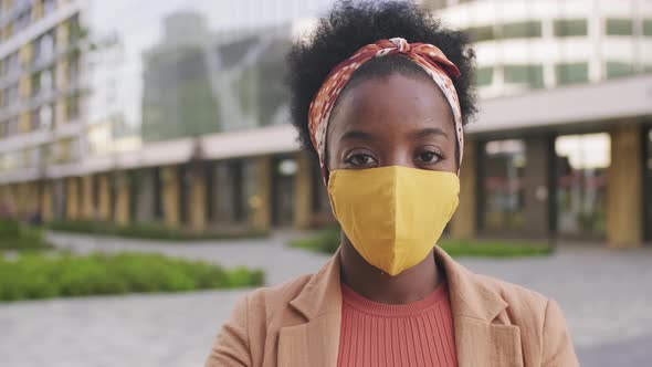  Portrait of Black Woman in Face Mask Outside