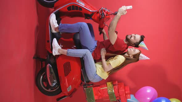 Happy Caucasian Couple, Celebrating a Birthday on a Motorcycle, Scooter, Cheerful Man and Woman with