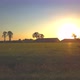 Aerial Cinematic Clip Drone Flying Over a Farm Field During Sunset - VideoHive Item for Sale