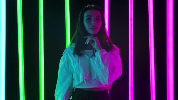 Portrait of a Pretty Young Beautiful Woman Passionately Looking at the Camera and Posing with Hands