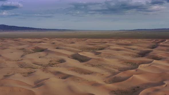 Aerial View of Sand Dunes in Desert at Sunset