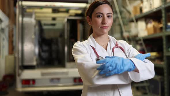 Walking around female doctor folding arms