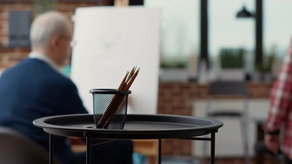 Colorful Pencils on Table in Creative Educational Workshop