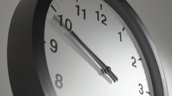 Clock Face In Time Lapse On White Wall 