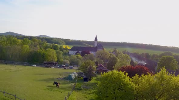 Cinematic drone footage of small castle in lower saxony, Germany at sunset.