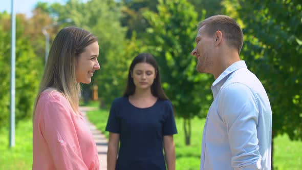 Jealous Brunette Girl Watching Her Friend Flirting With Guy She Likes, Betrayal