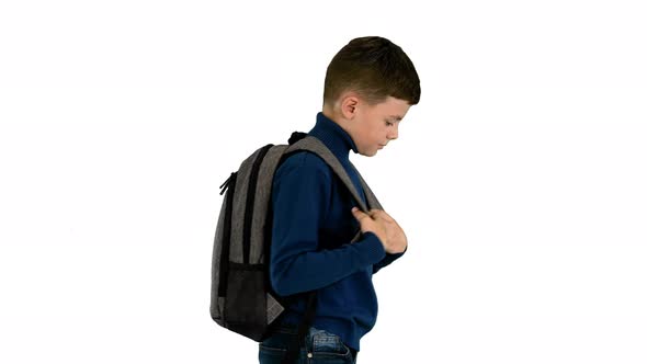 Cheerful Boy in Polo Neck Walking with a Backpack on White Background