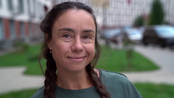 Shy Smiling Woman Standing on Street of City, Closeup Portrait of Natural Beauty Lady