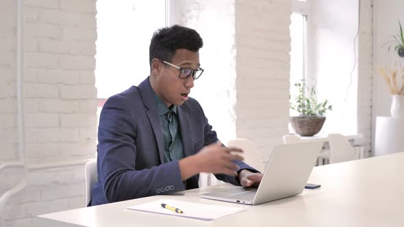 Shocked Businessman Working on Laptop Astonished