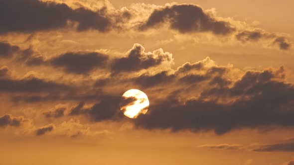 Bright Colorful Sunset Sky with Rays of Setting Sun and Vivid Dark Clouds