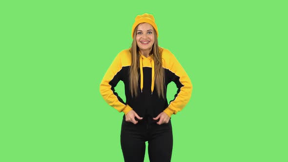 Modern Girl in Yellow Hat in Anticipation of Worries, Then Disappointed and Upset. Green Screen