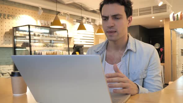 Displeased Angry Man Reacting to Problems of Work in Cafe