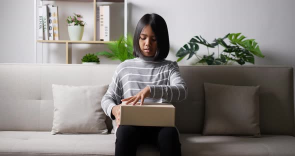 Teen girl opening gift box