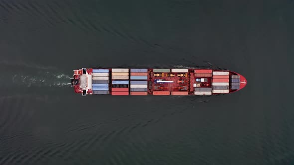 Drone View Vertically Down of the a Container Vessel in Motion