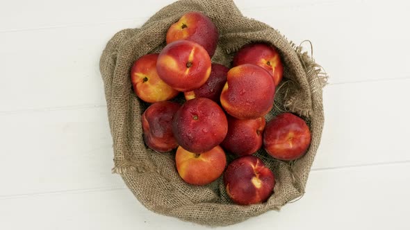 Sweet Peaches on the Table with Burlap Cloth