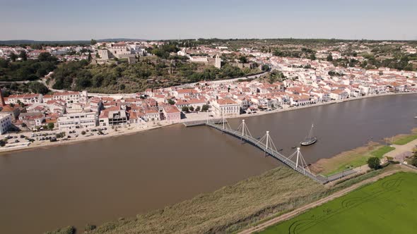 Bridge over Sado river and Alcaçer do Sal riverside cityscape, Alentejo, Portugal
