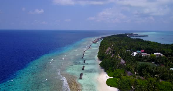 Wide flying abstract view of a white sand paradise beach and aqua blue water background in best qual