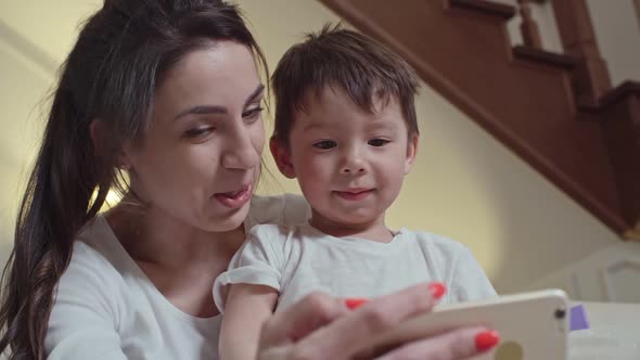 Adorable Mother and Son Taking Selfie