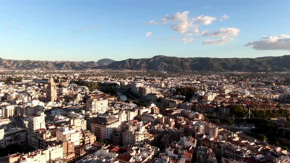 Drone shot of Murcia city and Segura River surrounded by mountains in Spain