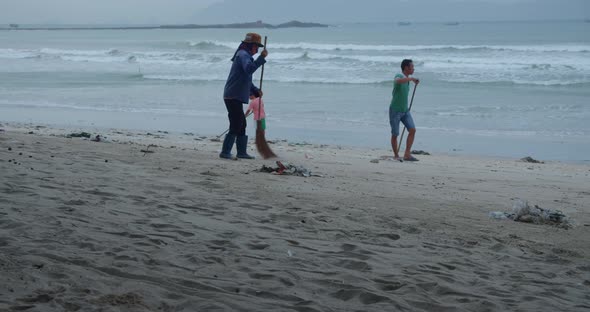 Group of Volunteer People Are Cleaning the Sea Beach
