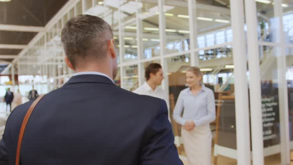 Colleagues talking in the foyer at a business convention