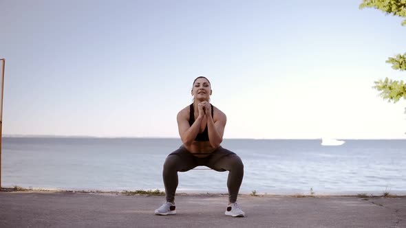 Beautiful Muscular Woman Enjoying Her Exercising Outdoors Near the Sea