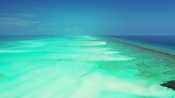 Aerial seascape of tropical bay beach break by turquoise ocean with white sand background of journey