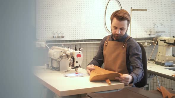 Male Leather Specialist at the Sewing Machine