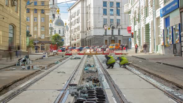 Workers Do Cleaning of the Railway Tram Line After Construction Works.