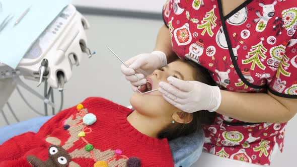 Little girl being treated by a dentist
