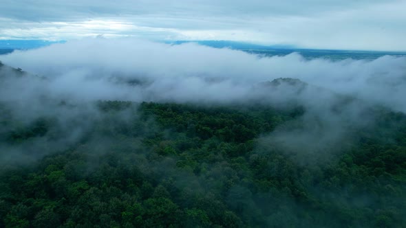 4K Aerial Drone shot flying over beautiful mountain ridge in rural jungle bush forest.