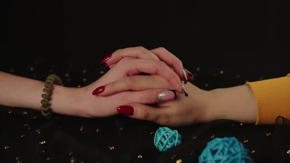 Crop Girl's Hand and Woman's Hand with Different Manicure