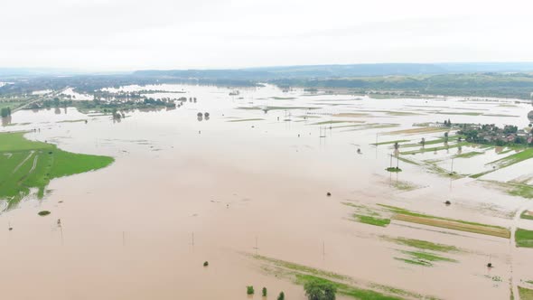 Aerial View River That Overflowed After Heavy Rains and Flooded Agricultural Fields