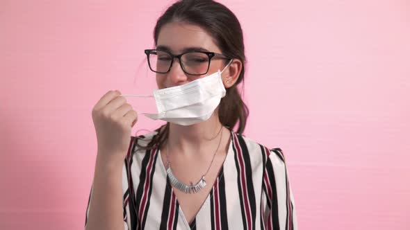 Young Woman Take Off Face Mask Removing From Face