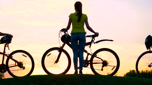 Young Cyclists at Beautiful Sunset