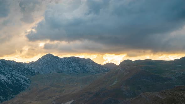 Sunset Mountains Landscape with Sun Rays Through the Clouds