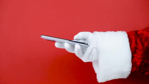 Santa Claus Hand Holding Smartphone Blank Screen
