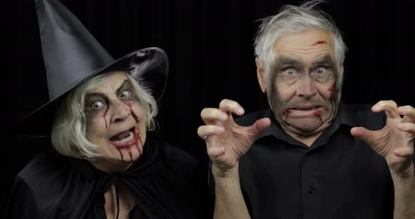 Elderly Man and Woman in Halloween Costumes, Witch and Zombie