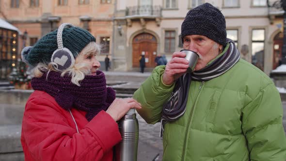 Senior Couple Tourists Grandmother Grandfather Drinking From Thermos Enjoying Hot Drink Tea Coffee