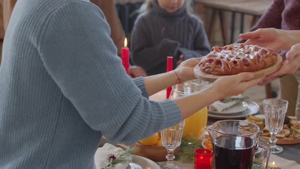 Mid-section of Family Setting Table on Christmas