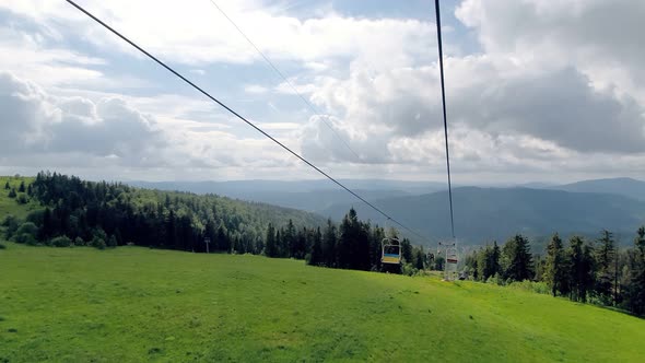 View From the Chair of the Cable Car on the Panorama of the Mountains on a Summer Sunny Day