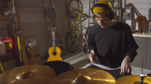 Man Spending Time In Garage Studio