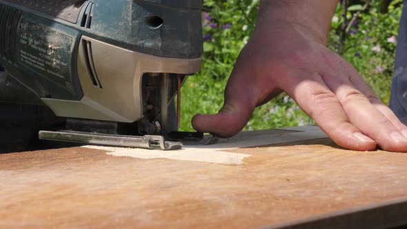 Close Up of Electric Jigsaw in Action